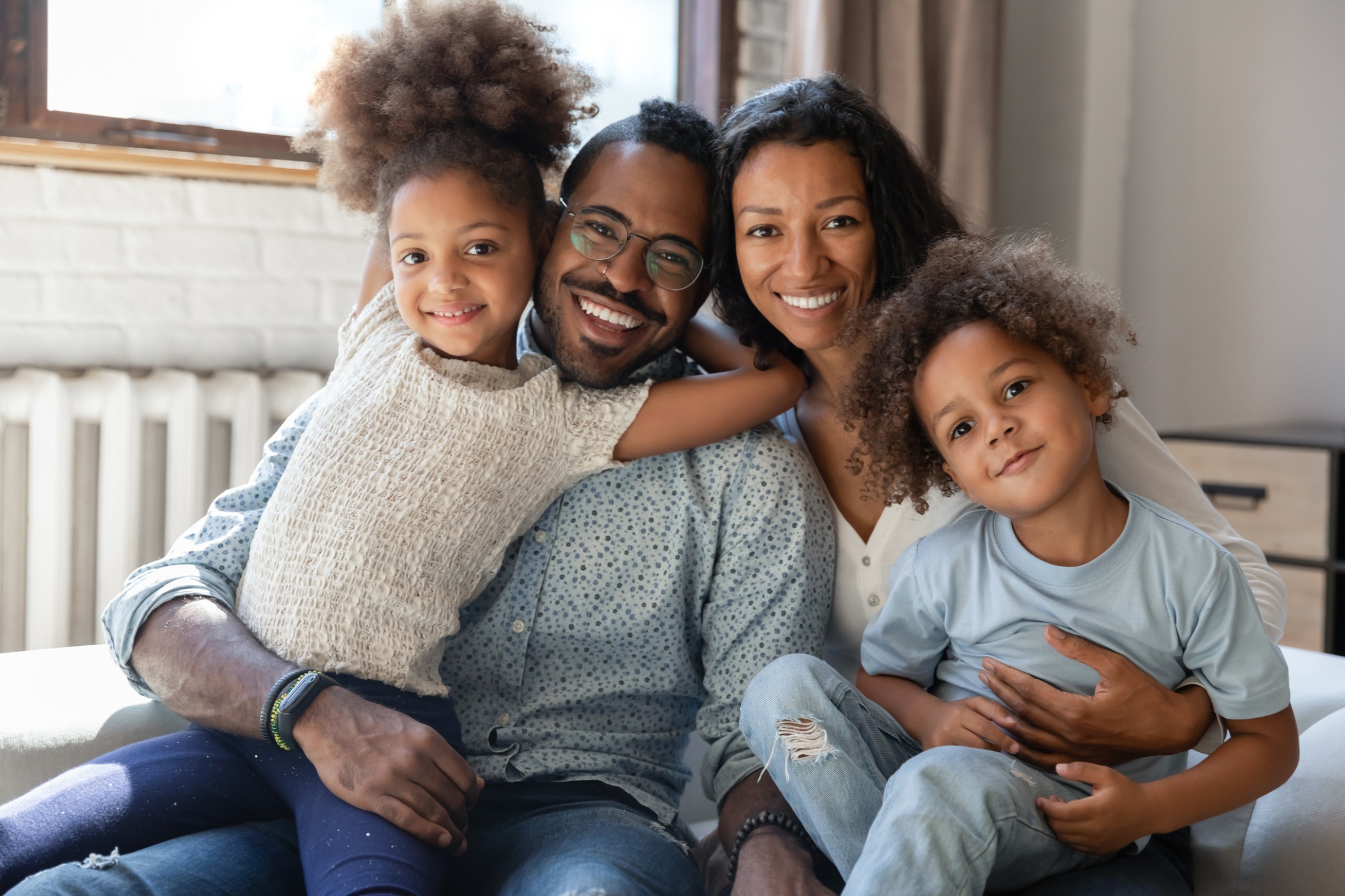 A family smiling at home