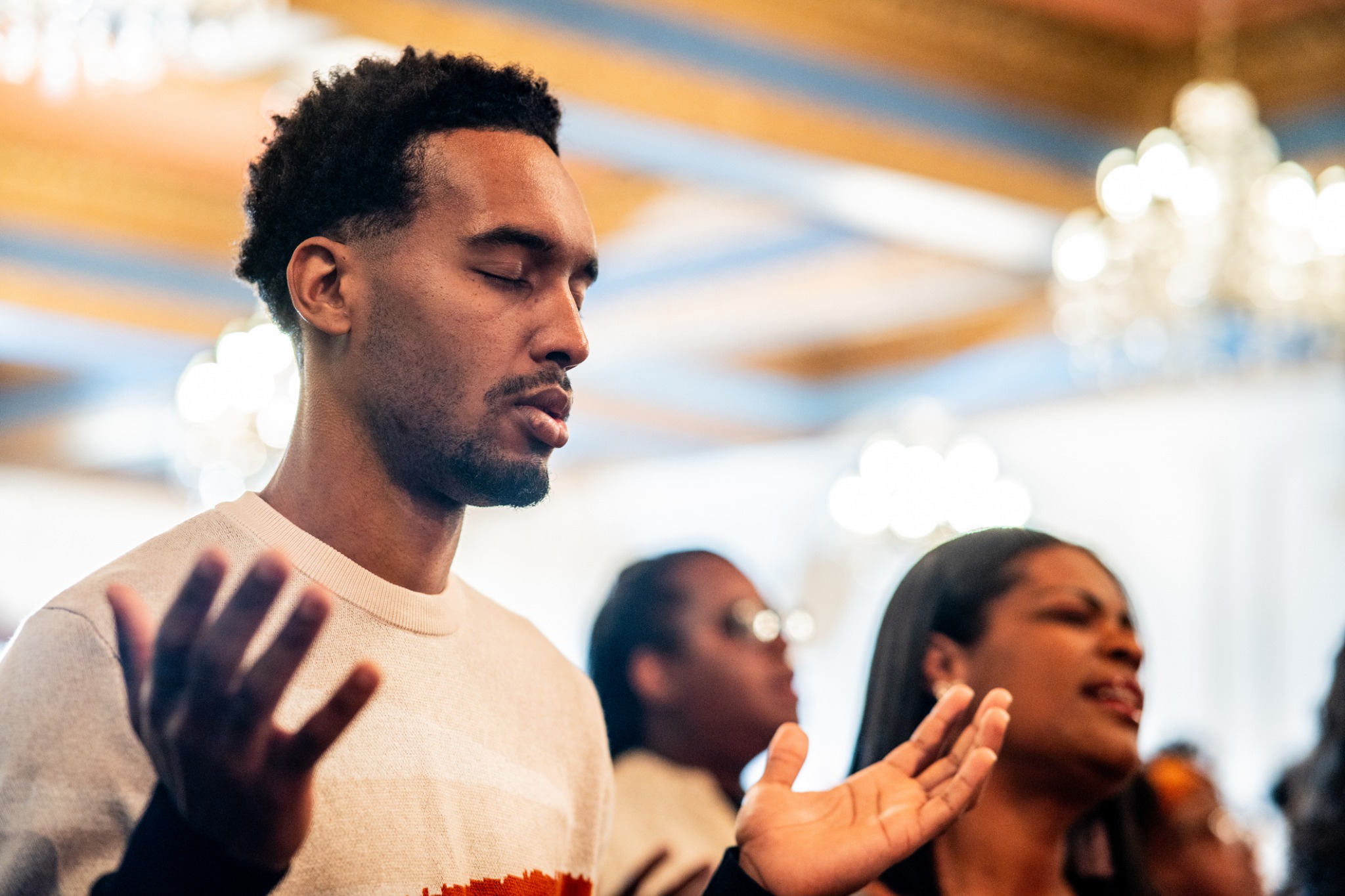A worshipper praying during church